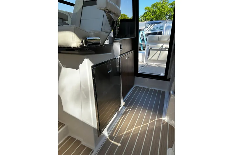 Slide: The Image of Interior of 2026 Solara S-250 Coupe, featuring sleek seating and modern cabinetry. - 22