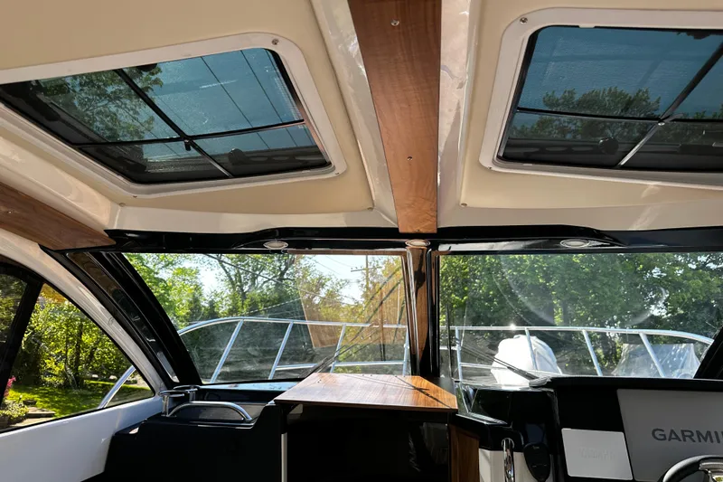 Slide: The Image of Interior view of 2026 Solara S-250 Coupe boat with sunroof and modern design. - 26