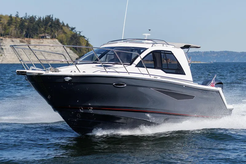 Slide: The Image of Manufacturer Provided Image: 2025 Solara S-250 Coupe cruising on open water, showcasing sleek design and performance. - 28