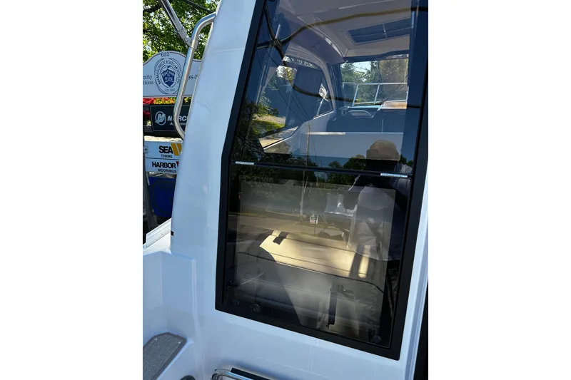 Slide: The Image of 2026 Solara S-250 Coupe boat with sleek window design and modern interior. - 4