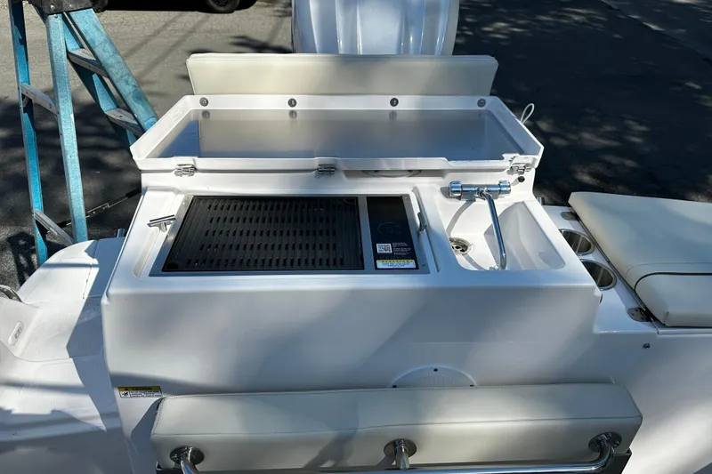 Slide: The Image of 2026 Solara S-250 Coupe boat with integrated grill and sink on deck. - 7