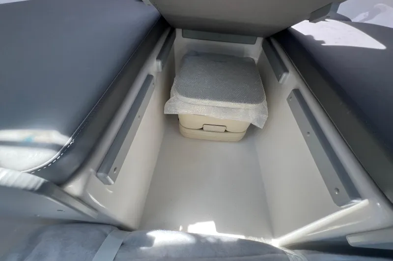 Slide: The Image of Interior storage compartment of 2026 Defiance Admiral 220 EX boat. - 14