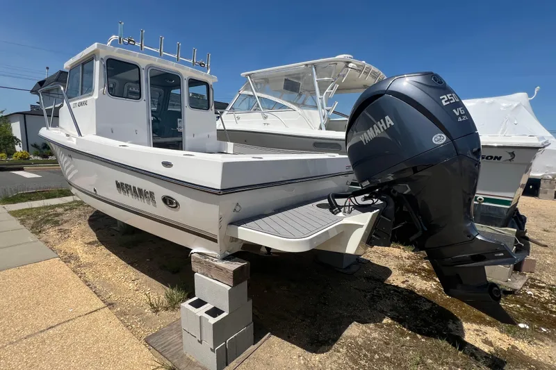 Slide: The Image of 2026 Defiance Admiral 220 EX boat with Yamaha 250 V6 engine on display. - 8