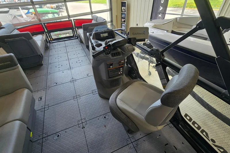 Slide: The Image of Interior of 2023 Sea-Doo Switch Cruise 21, featuring spacious seating and modern controls. - 10