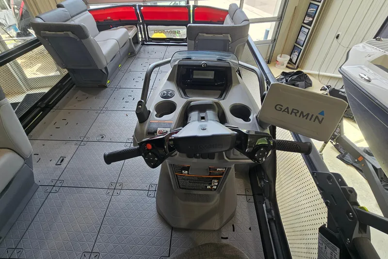 Slide: The Image of 2023 Sea-Doo Switch Cruise 21 interior with Garmin navigation system and spacious seating. - 11