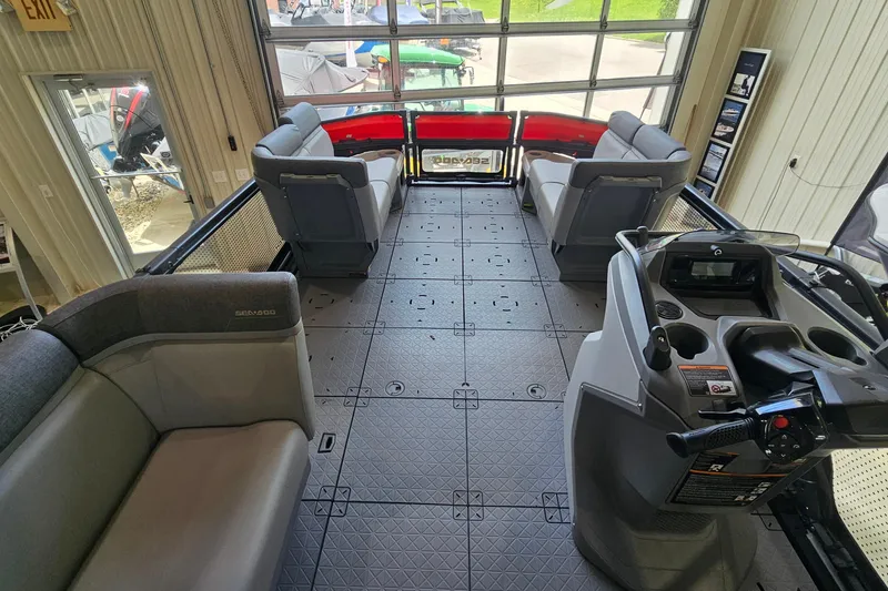 Slide: The Image of 2023 Sea-Doo Switch Cruise 21 interior with spacious seating and modern helm controls. - 12