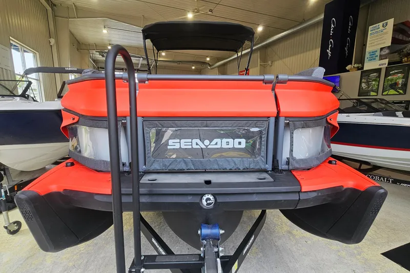 Slide: The Image of 2023 Sea-Doo Switch Cruise 21 in showroom, rear view showcasing vibrant design. - 3