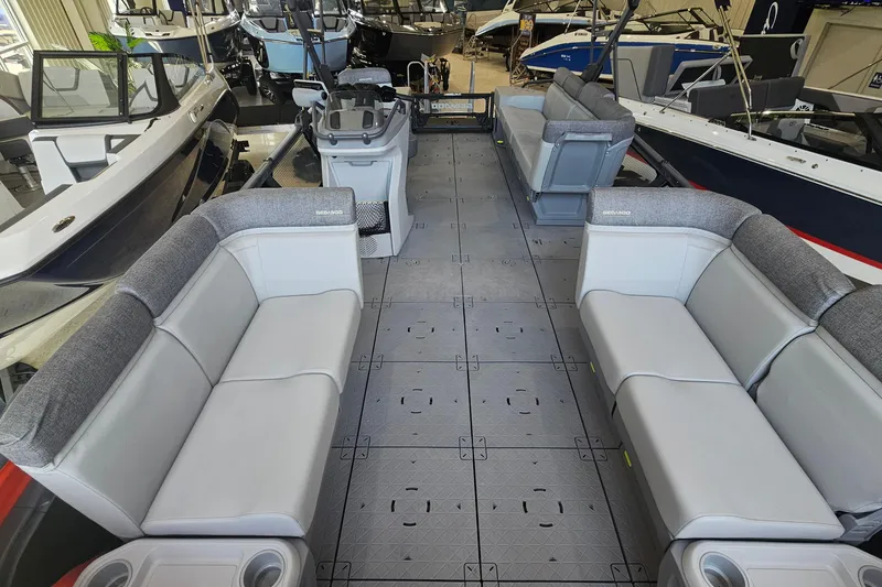 Slide: The Image of 2023 Sea-Doo Switch Cruise 21 interior with spacious seating and modern design in showroom. - 6
