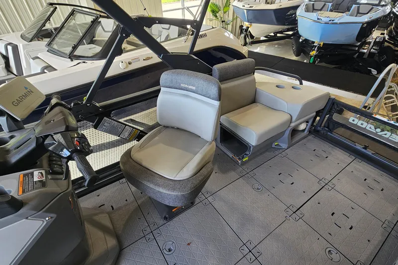 Slide: The Image of 2023 Sea-Doo Switch Cruise 21 interior with seating and control panel in showroom. - 8