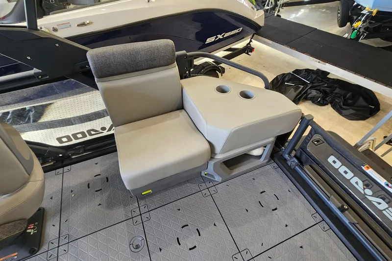 Slide: The Image of 2023 Sea-Doo Switch Cruise 21 interior seating with cup holders, showcasing modern design. - 9