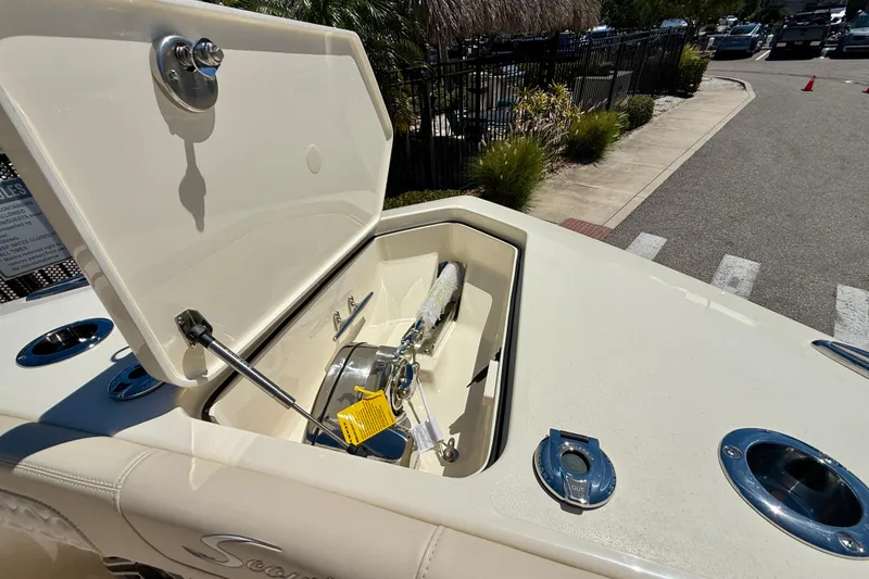 Slide: The Image of Open anchor compartment on 2026 Scout 260 LXF boat, showcasing storage and mechanism. - 14