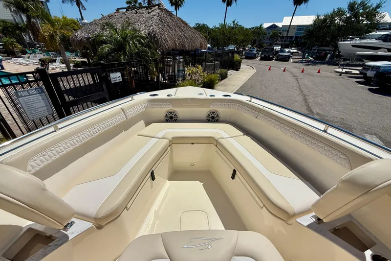 Slide: The Image of 2026 Scout 260 LXF boat interior with beige seating and modern design. - 15