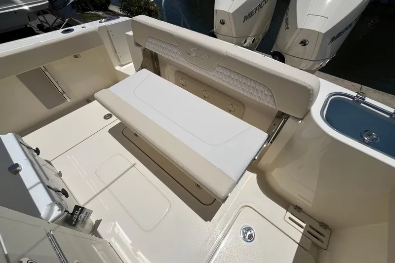 Slide: The Image of 2026 Scout 260 LXF boat interior with seating and Mercury engines. - 25