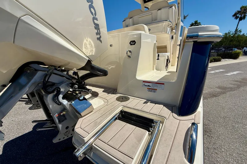 Slide: The Image of 2026 Scout 260 LXF boat with Mercury engine, featuring a sleek deck and seating area. - 28