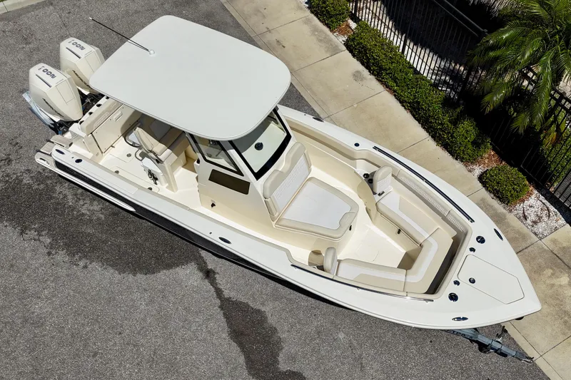 Slide: The Image of 2026 Scout 260 LXF boat, aerial view, showcasing sleek design and spacious seating. - 5