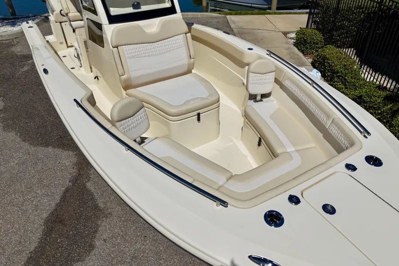 Slide: The Image of 2026 Scout 260 LXF boat interior with luxurious seating and sleek design. - 6