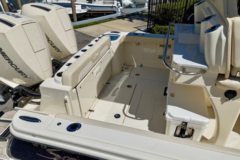 Slide: The Image of 2026 Scout 260 LXF boat interior with Mercury engines, featuring spacious seating and storage. - 8