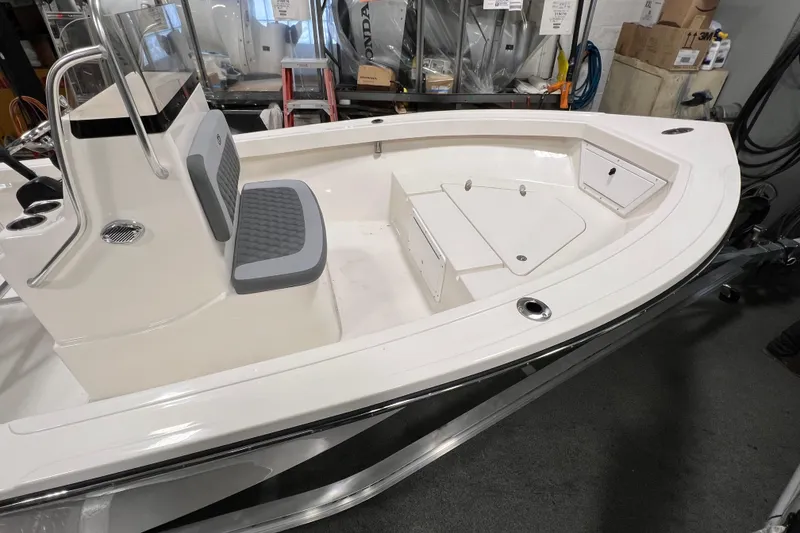 Slide: The Image of 2026 Defiance Catalina 190 boat interior with seating and storage compartments. - 3