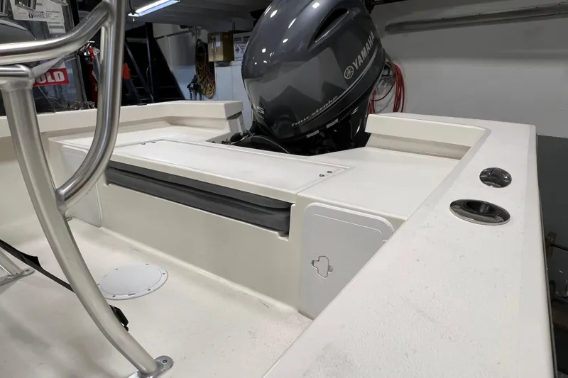 Slide: The Image of 2026 Defiance Catalina 190 boat with Yamaha outboard motor in a garage setting. - 5