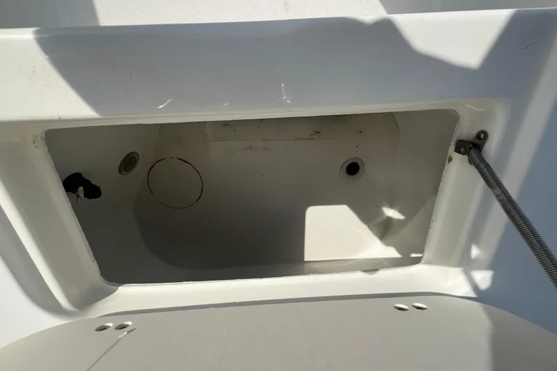 Slide: The Image of Open storage compartment on a 2000 Hydra-Sports 230 Seahorse CC boat. - 10