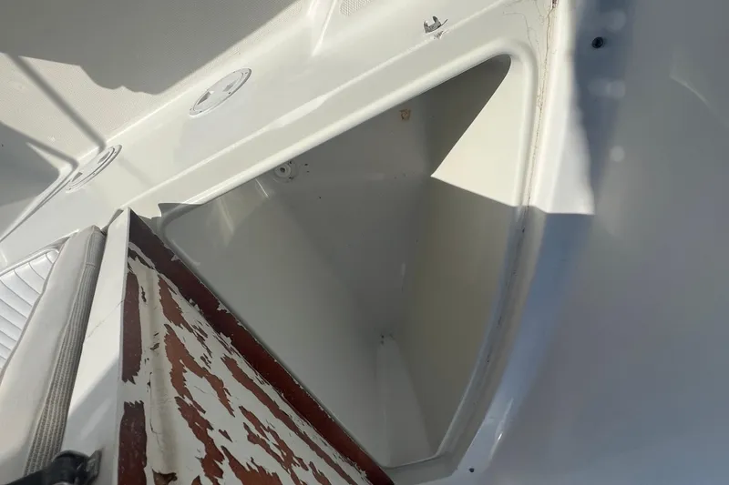 Slide: The Image of Storage compartment of a 2000 Hydra-Sports 230 Seahorse CC boat, showing interior details. - 18