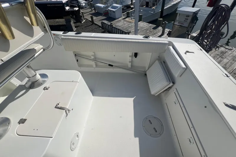 Slide: The Image of 2000 Hydra-Sports 230 Seahorse CC boat interior with seating and storage compartments. - 8
