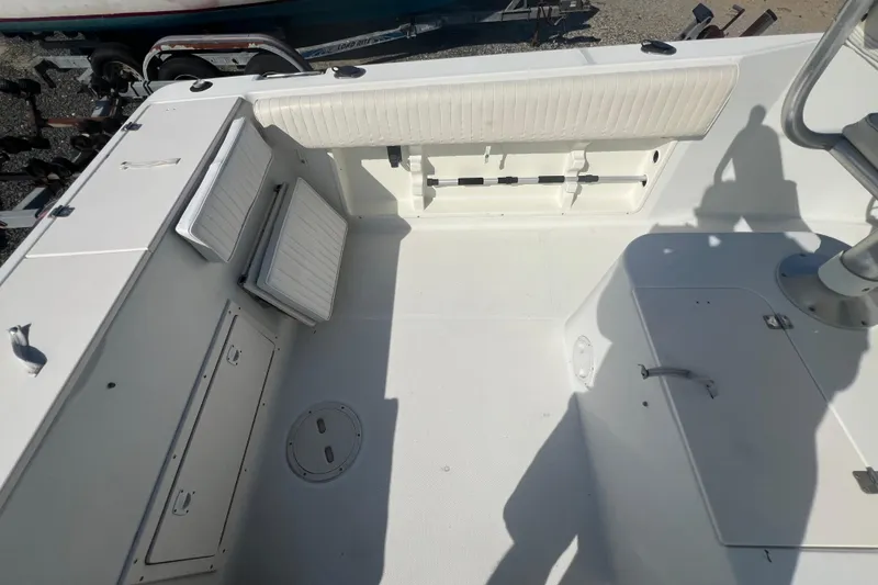 Slide: The Image of 2000 Hydra-Sports 230 Seahorse CC boat interior with seating and storage compartments. - 9