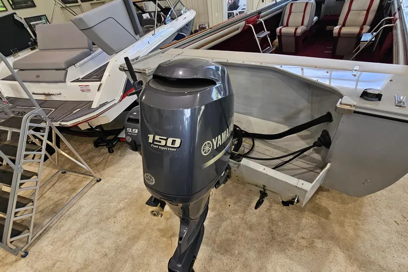 Slide: The Image of 1988 Crestliner 2281 boat with Yamaha 150 outboard motor in showroom. - 4