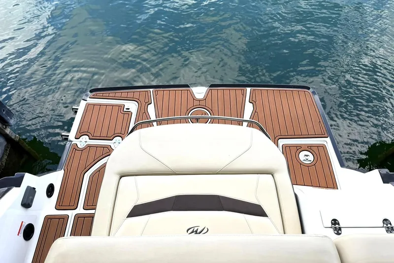 Slide: The Image of 2016 Monterey 258SS Super Sport boat with teak deck, docked on calm water. - 34