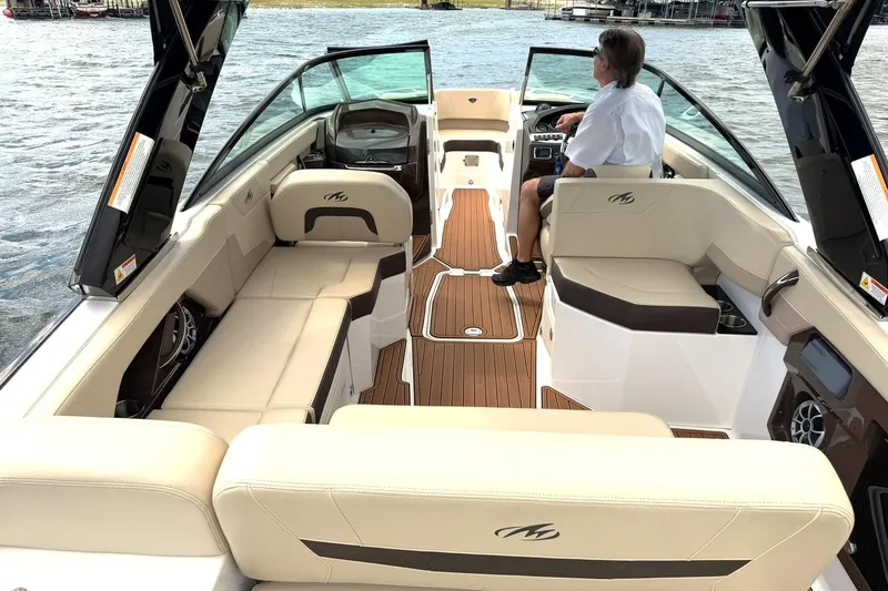 Slide: The Image of 2016 Monterey 258SS Super Sport boat interior with luxurious seating and wood accents. - 36