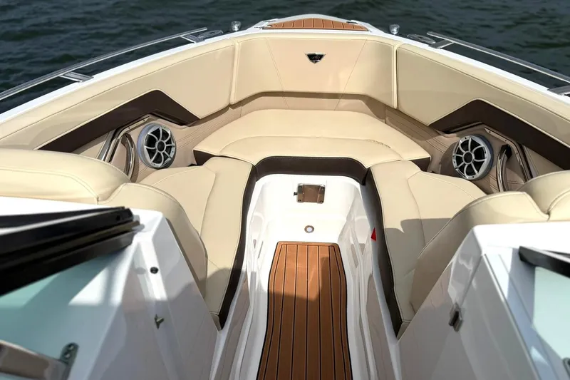 Slide: The Image of Luxurious interior of 2016 Monterey 258SS Super Sport boat with beige seating and wood accents. - 4
