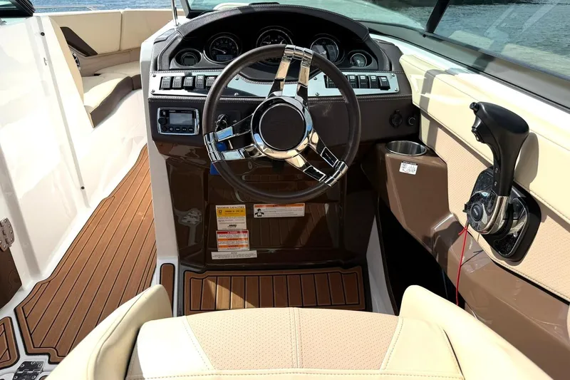 Slide: The Image of Interior view of 2016 Monterey 258SS Super Sport boat cockpit with steering wheel and controls. - 5
