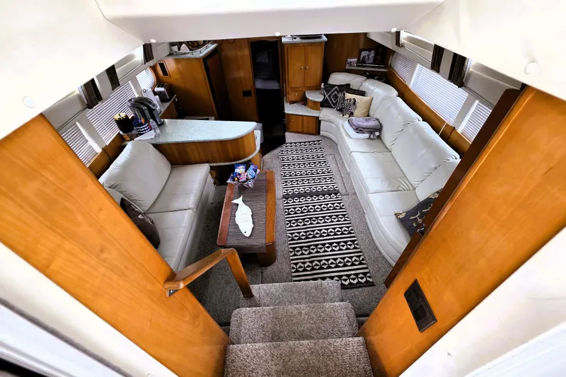 Slide: The Image of Luxurious interior of 2001 Carver 396 Aft Cabin Motor Yacht with cozy seating and modern decor. - 1