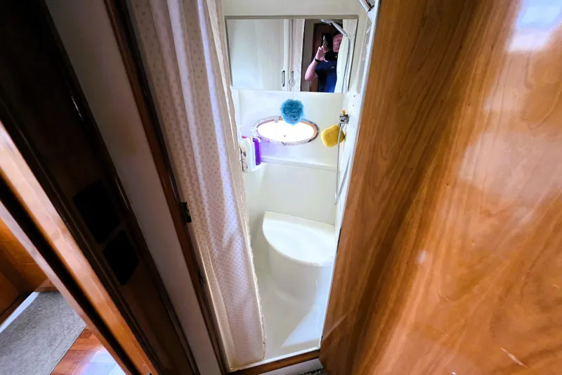 Slide: The Image of Bathroom interior of 2001 Carver 396 Aft Cabin Motor Yacht with shower and porthole. - 10