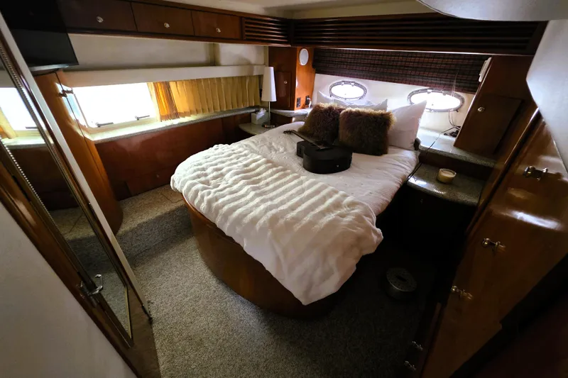 Slide: The Image of Luxurious bedroom in 2001 Carver 396 Aft Cabin Motor Yacht with cozy bedding. - 11