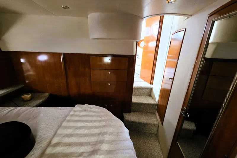Slide: The Image of Luxurious interior of 2001 Carver 396 Aft Cabin Motor Yacht bedroom. - 12