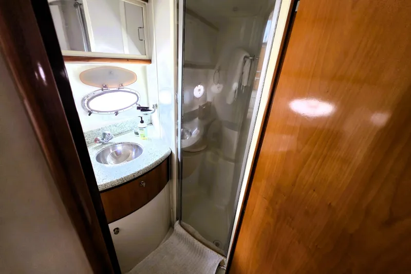 Slide: The Image of 2001 Carver 396 Aft Cabin Motor Yacht bathroom with sink and shower. - 13