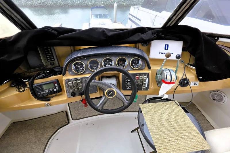 Slide: The Image of Helm of 2001 Carver 396 Aft Cabin Motor Yacht with steering wheel and control panel. - 15