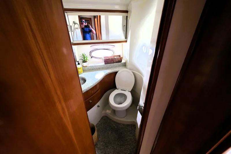 Slide: The Image of Bathroom interior of 2001 Carver 396 Aft Cabin Motor Yacht, featuring toilet and sink. - 8