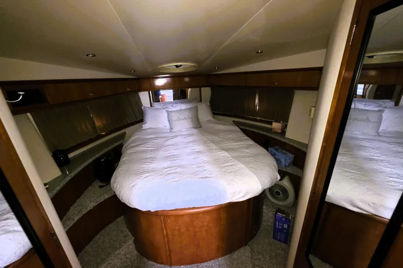 Slide: The Image of Luxurious bedroom in 2001 Carver 396 Aft Cabin Motor Yacht with cozy bedding. - 9