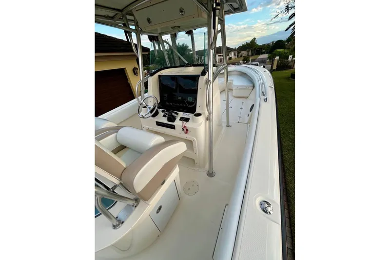 Slide: The Image of 2008 Pursuit C 340 Center Console boat interior with steering wheel and seating. - 6