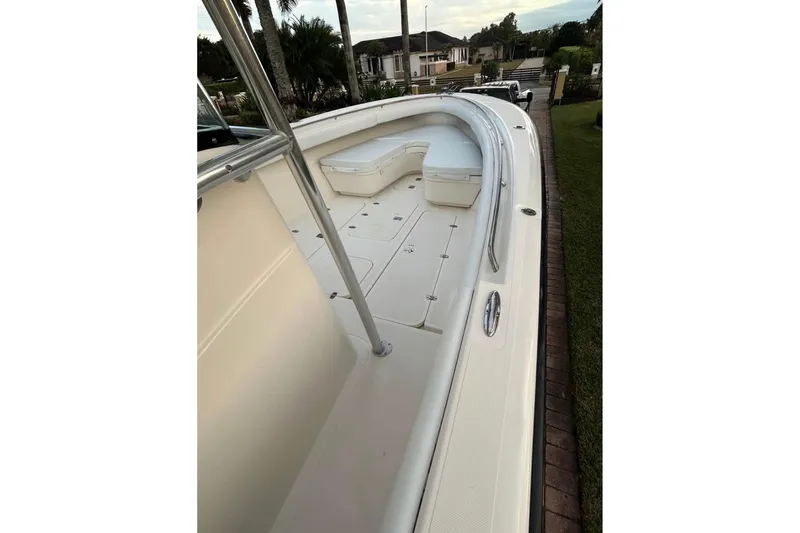 Slide: The Image of 2008 Pursuit C 340 Center Console boat deck with seating and railing. - 8