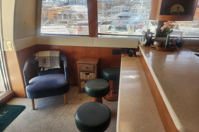 Slide: The Image of Interior of a 1998 Carver 530 Voyager Pilothouse with seating and decor. - 11