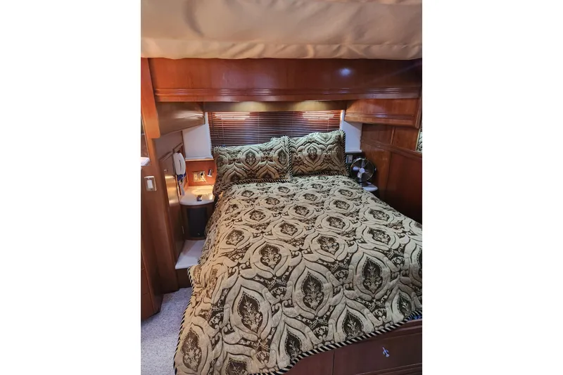 Slide: The Image of Luxurious bedroom interior of 1998 Carver 530 Voyager Pilothouse with ornate bedding. - 23
