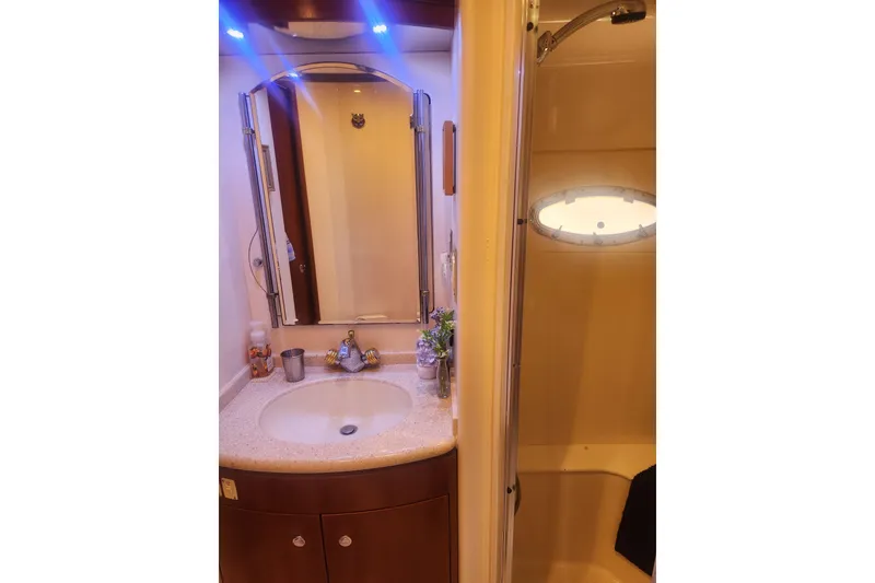 Slide: The Image of Luxurious bathroom in 1998 Carver 530 Voyager Pilothouse yacht with elegant fixtures. - 26