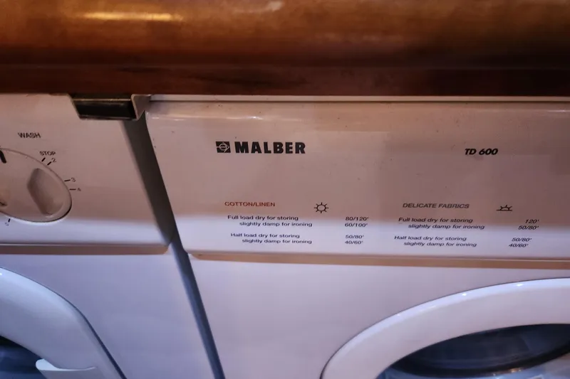 Slide: The Image of Malber TD 600 dryer control panel with settings for cotton and delicate fabrics. - 29