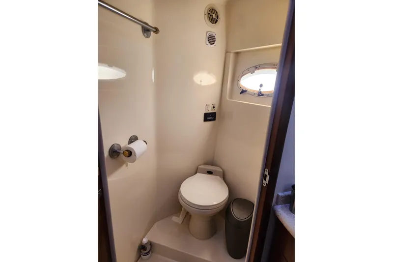 Slide: The Image of Bathroom interior of 1998 Carver 530 Voyager Pilothouse yacht with porthole window. - 30