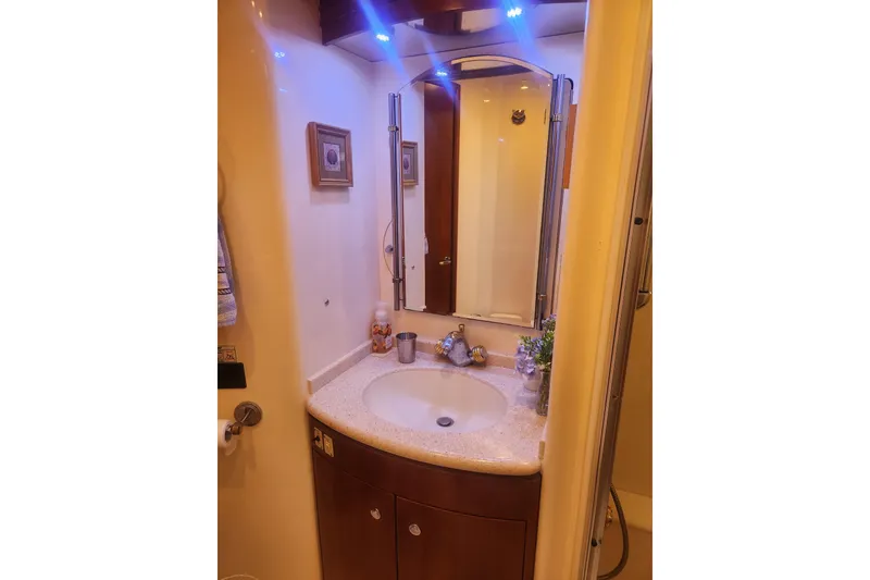 Slide: The Image of Luxurious bathroom in 1998 Carver 530 Voyager Pilothouse yacht with elegant fixtures. - 35
