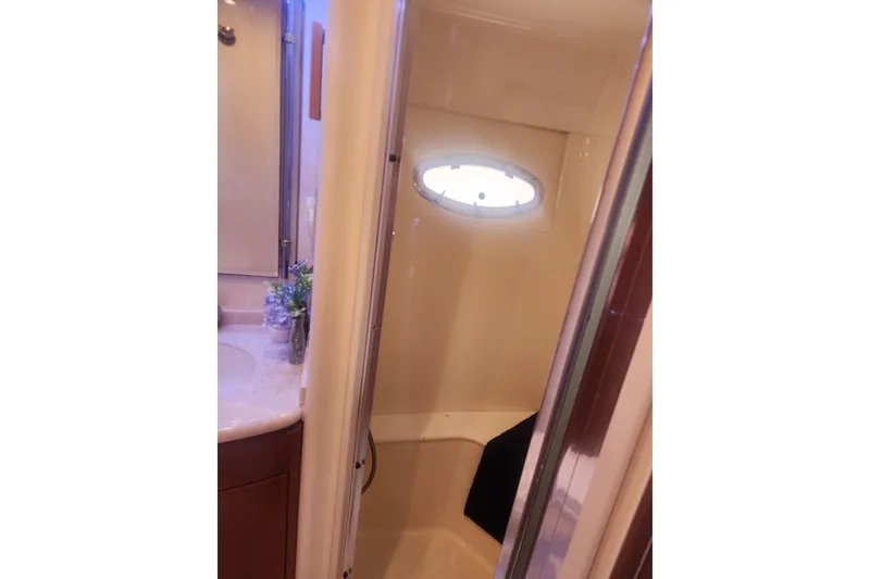 Slide: The Image of Bathroom interior of 1998 Carver 530 Voyager Pilothouse yacht with shower and porthole. - 36