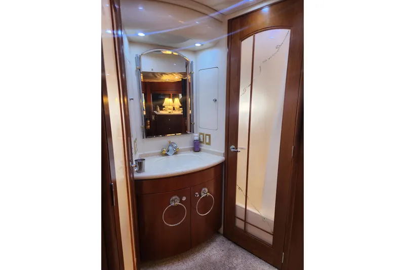 Slide: The Image of Luxurious bathroom interior of 1998 Carver 530 Voyager Pilothouse yacht with elegant wood finishes. - 40